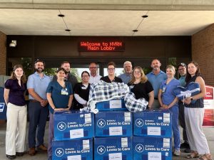 Subaru employees and NVRH staff with donated blankets