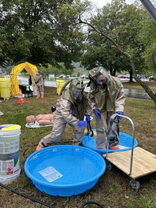 Emergency responders practice decontamination procedures during an emergency simulation drill at NVRH.
